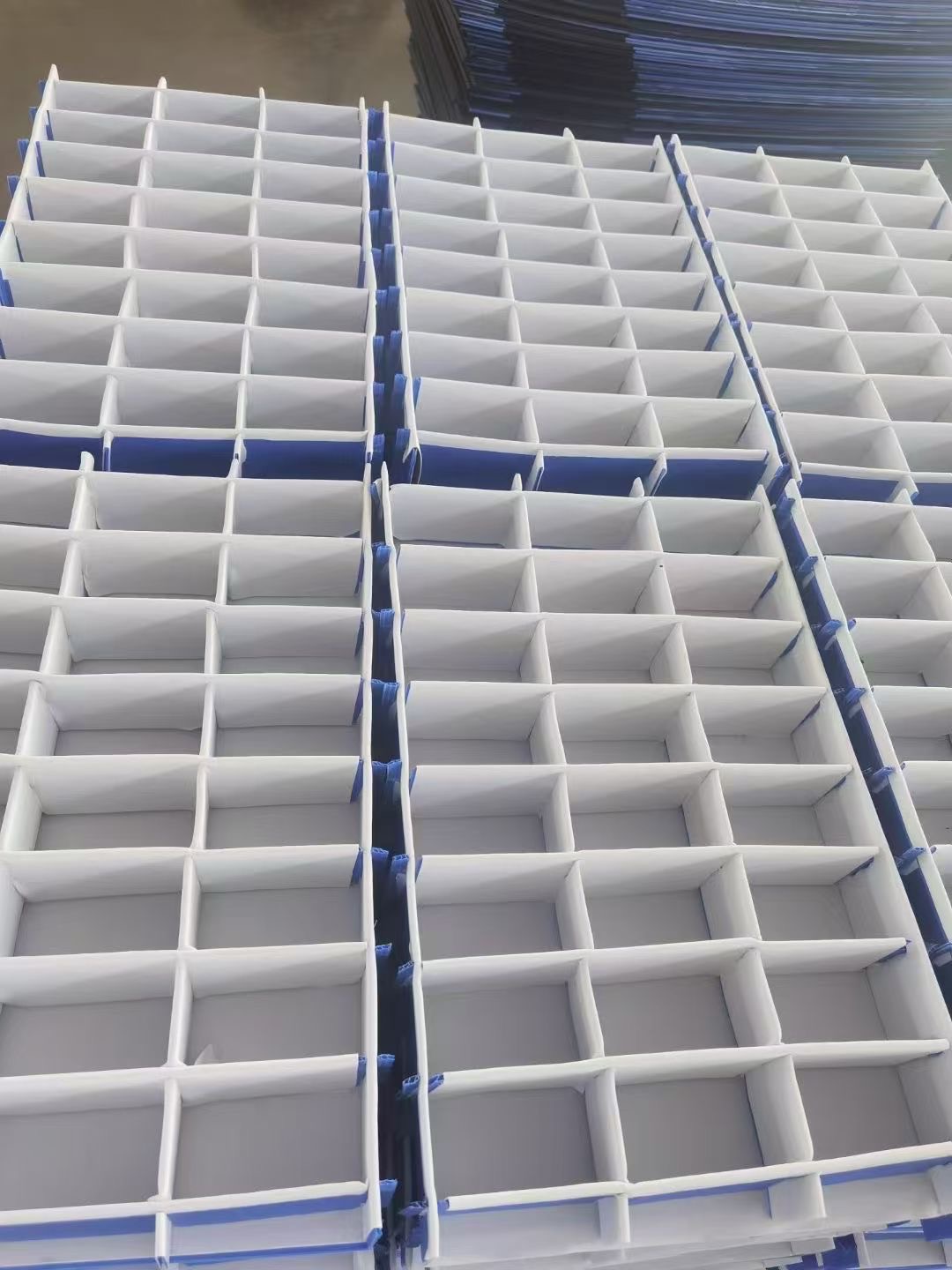 Stacked white PP hollow sheet divider sets for box inserts