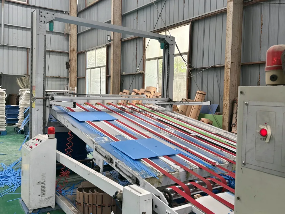 Colored plastic sheets on a factory cutting line
