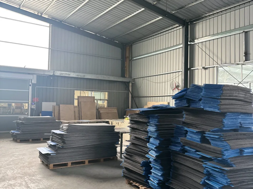 Converted PP corrugated sheet components stacked on pallets